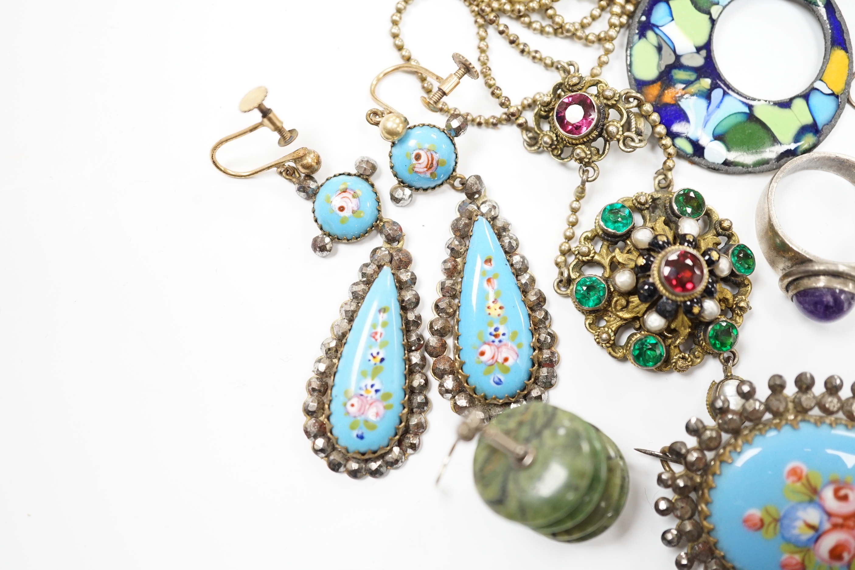 An Art Nouveau style sterling and enamelled double photograph frame, width 11.3cm, together with sundry jewellery including an Austro-Hungarian style necklace, white metal and cabochon amethyst set ring(stamped silver) e